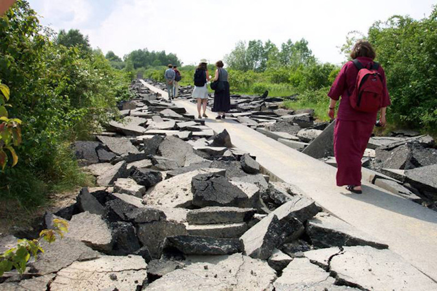 Person walking on narrow cement path