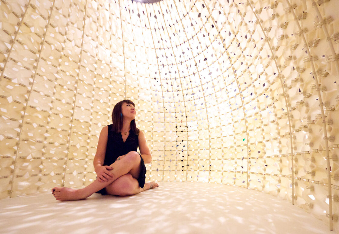 Woman inside of 3D Printed Building