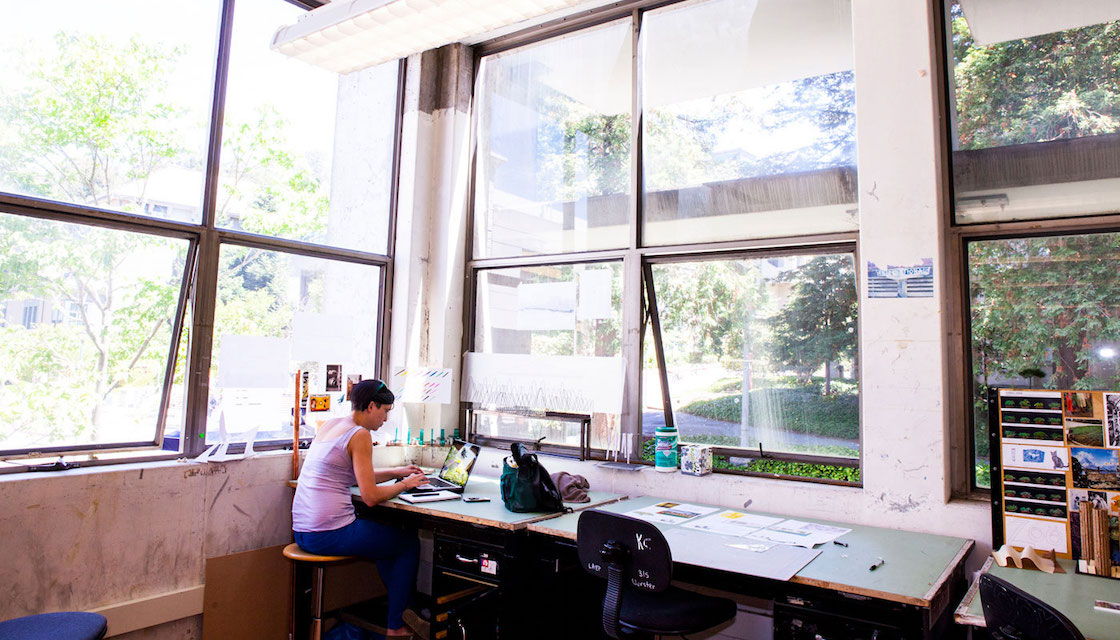 student working at desk in wurster hall