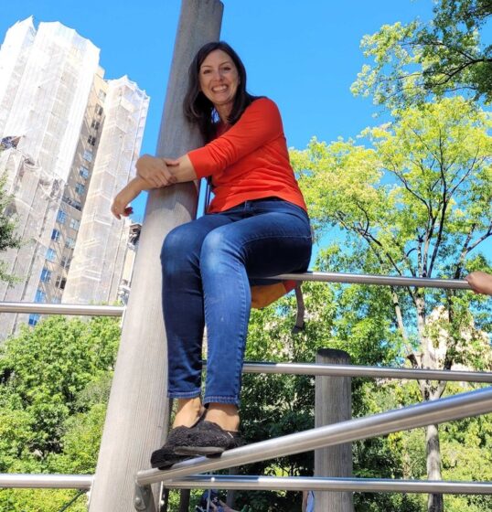 Meghan Talarowski sitting on playground