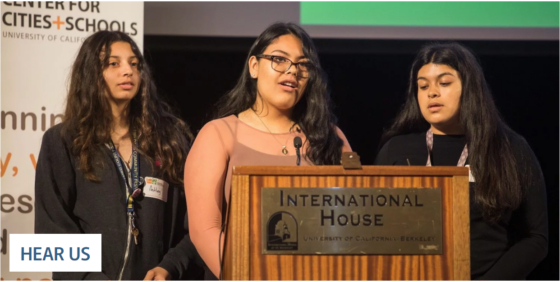 picture of students speaking at a podium