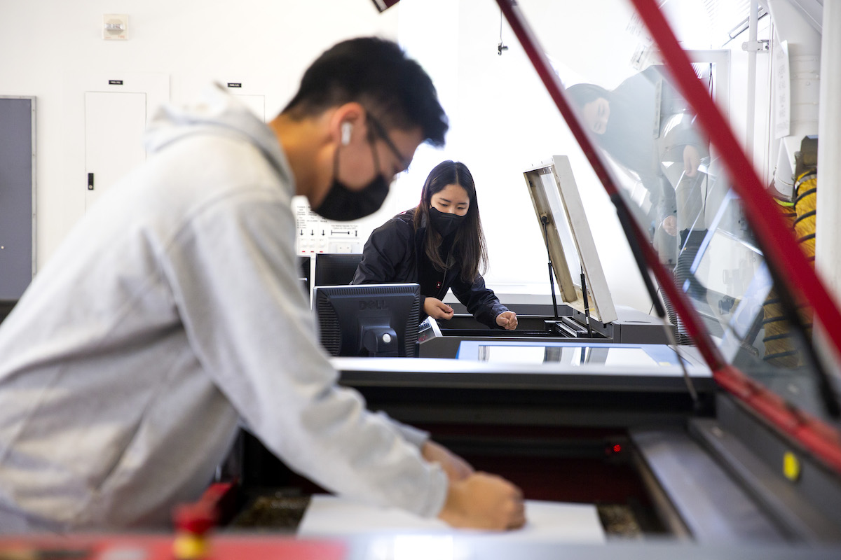 Two students working in CED's Fabrication Lab