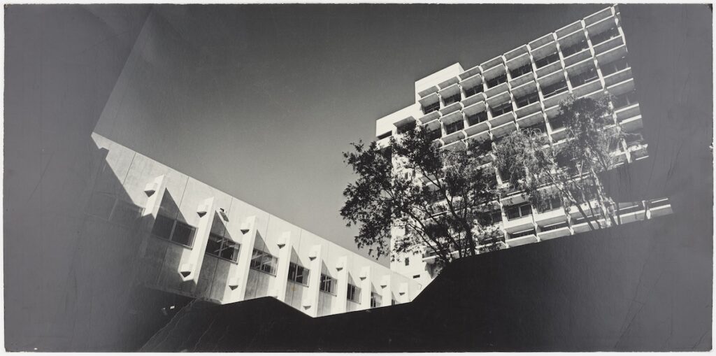 Black-and-white photograph looking up at south facade of Wurster Hall from the courtyard.