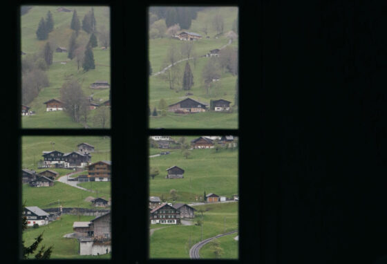 View through paned windows to farm landscape