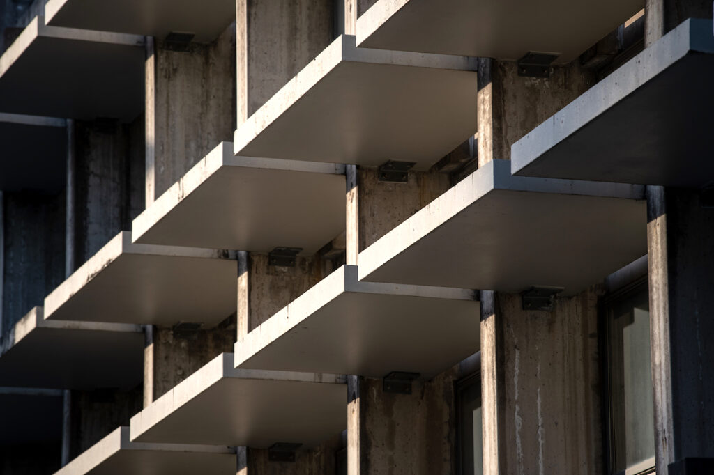 Detail of building facade with concrete sunbreakers