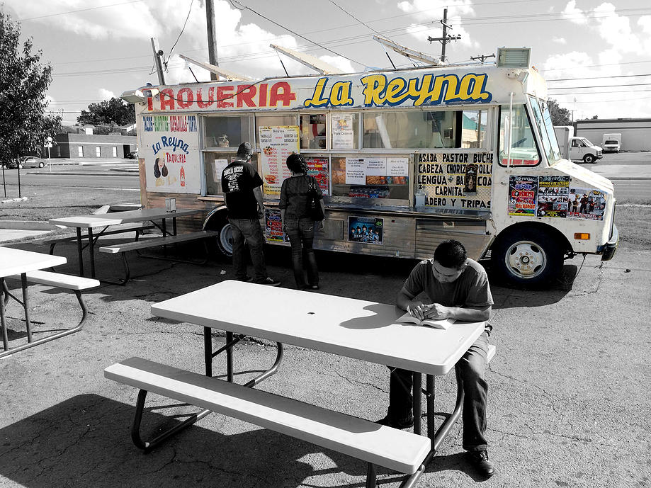 taco truck with people eating