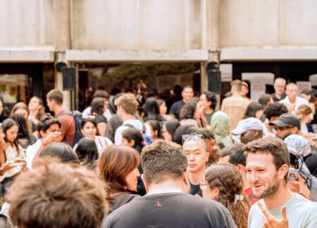 people socializing in front of building