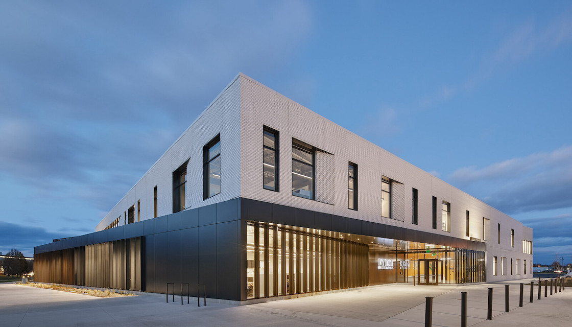 AN Best of Design Award editor's pick by Iwamoto Scott. Two story building from corner photographed at dusk