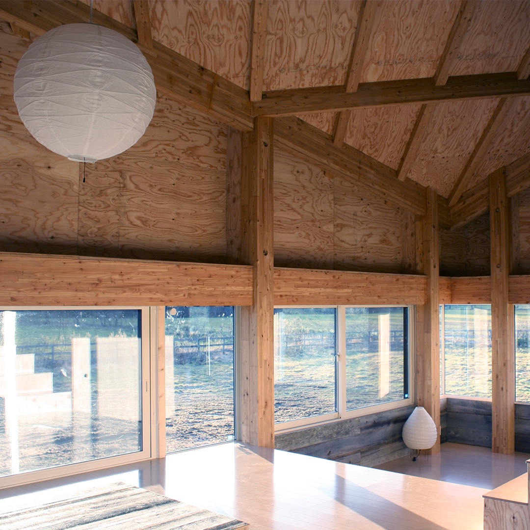 Matt Conway's Horizon House's interior living space with wood and large windows