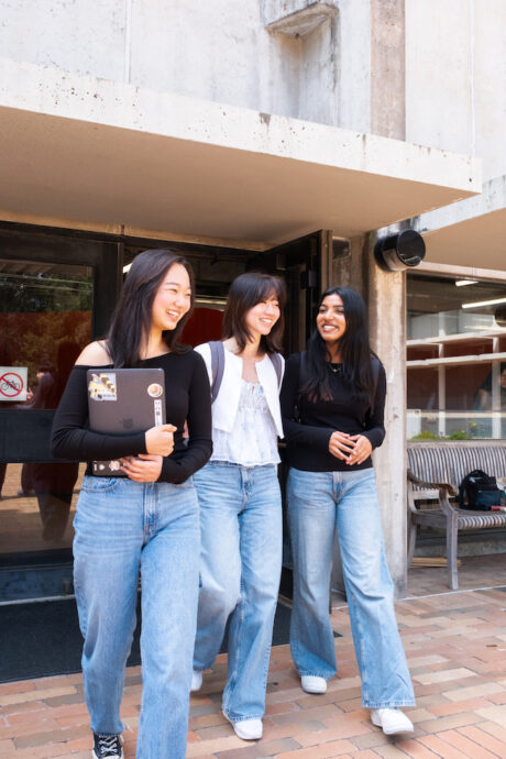 students walking out of Bauer Wurster smiling