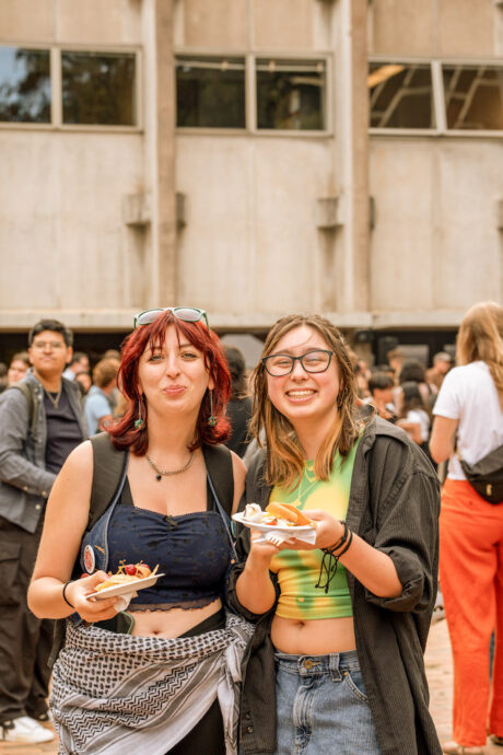 Two students smiling