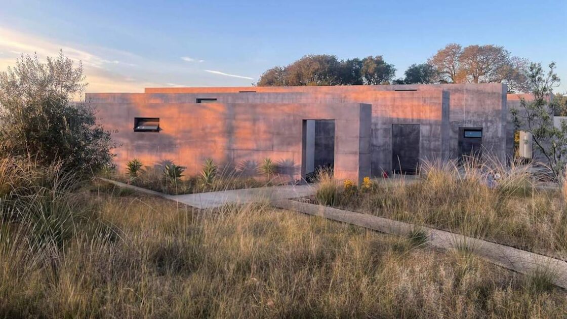 Building in field in golden light