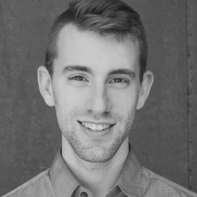 Headshot of a man with designer stubble