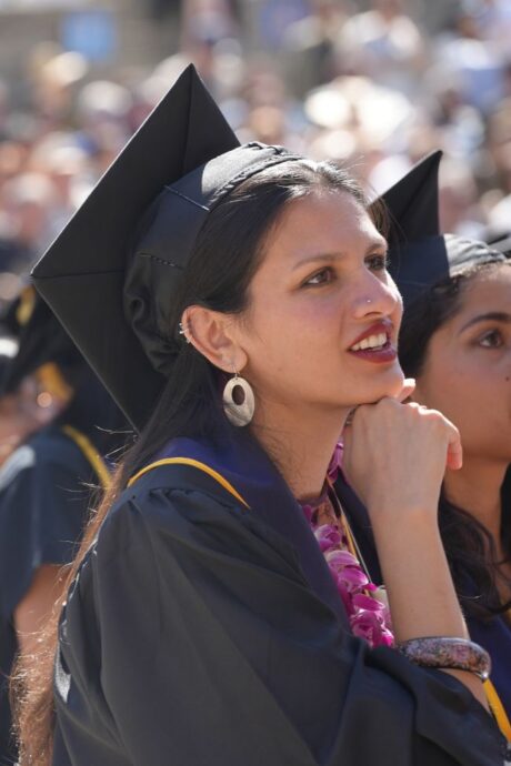 Undergraduate student smilining at the College of Environmental Design's 2025 Commencement ceremony