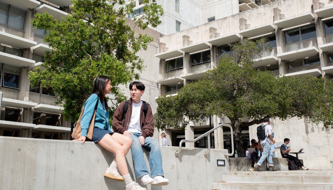 Students sitting in plaza outside Bauer Wurster Hall