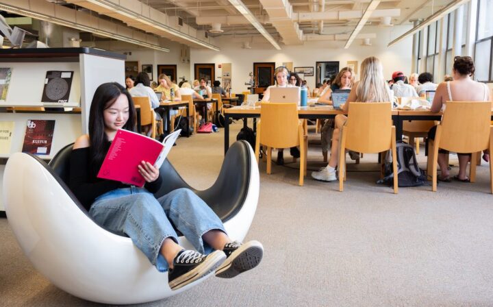 Student reading in library