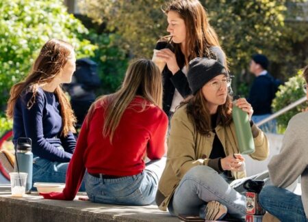 College of Environmental Design admissions people smiling in courtyard